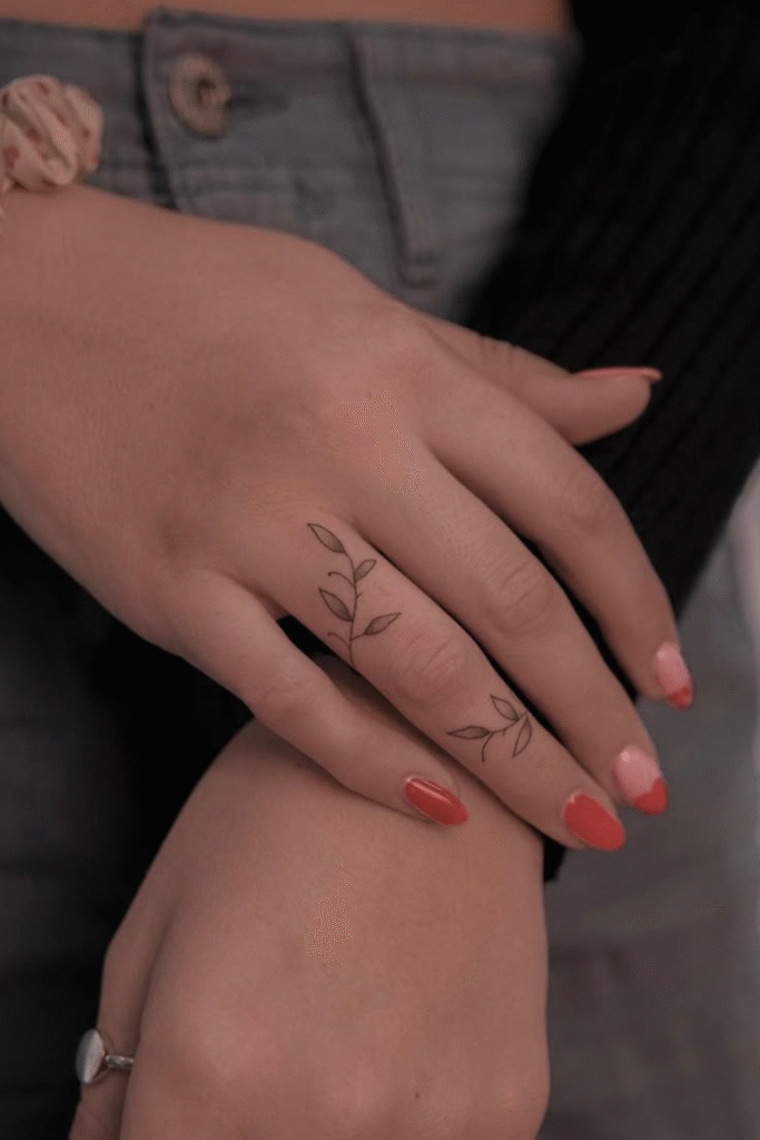 Delicate ivy winding around the finger