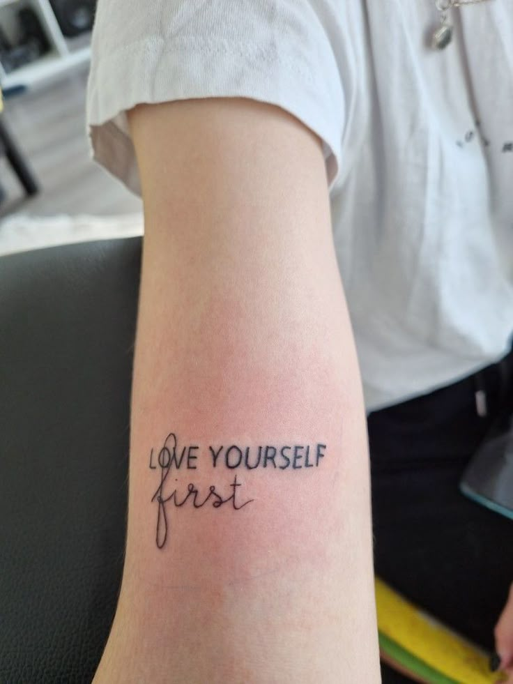 “Love Yourself First” on the side of the wrist